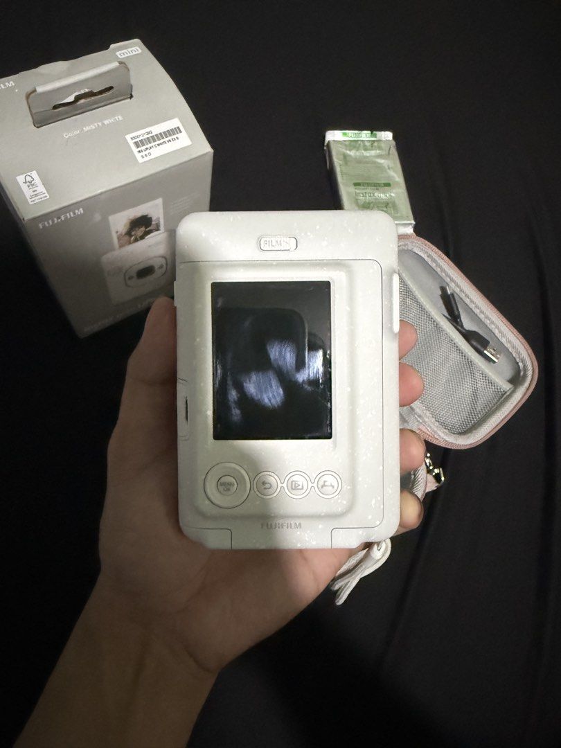 Fujifilm Instax mini LiPlay (Category: Cameras) located in Manila. Submitted by naztymac (Listing ID 1443362381, Image 3). Description: Fujifilm Instax mini LiPlay Color: Misty White Comes with: - OG box - Instax mini film (10pcs) - Instax case - Tempered glass - USB to type C cable Note: SD card not included.