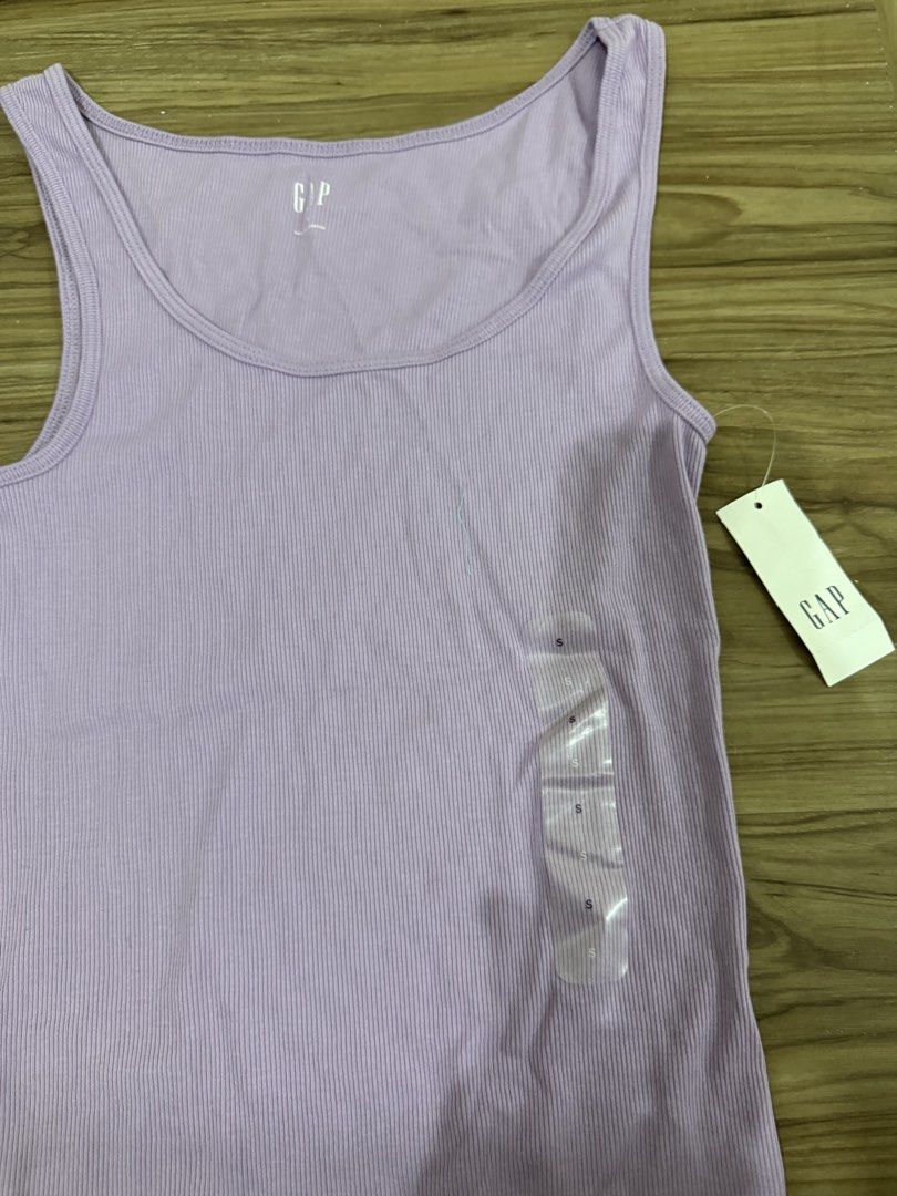 GAP Ribbed Tank Top Lavender Size S (Category: Sleeveless) located in Manila. Submitted by kmd22 (Listing ID 1443431381, Image 1). Description: - Brand: GAP - Color: Lavender - Style: Ribbed Tank Top - Size: S - Condition: Brand new with tags - Material: Comfortable and stretchy - Versatile: Great for layering or wearing alone.