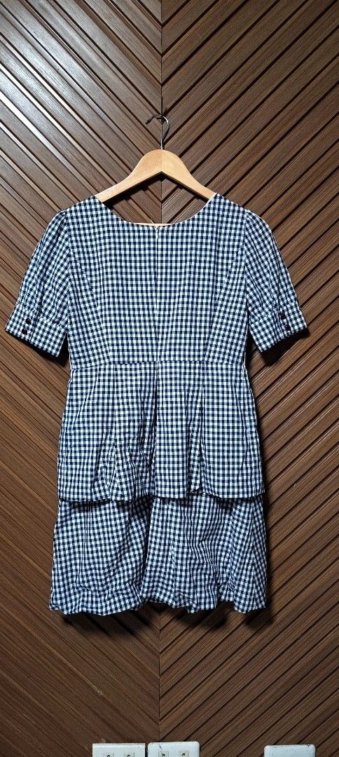 Gingham Tiered Dress with Puff Sleeves (Category: Dresses) located in Davao. Submitted by fabmegashop (Listing ID 1443420596, Image 2). Description: - Adorable black and white gingham pattern - Short puff sleeves for a sweet touch - Flattering tiered skirt design - Bodice features elegant pleating detail - Convenient back zipper closure - Approximate measurements: 17 inches length, 13 inches across the waist - Ideal for casual outings and everyda