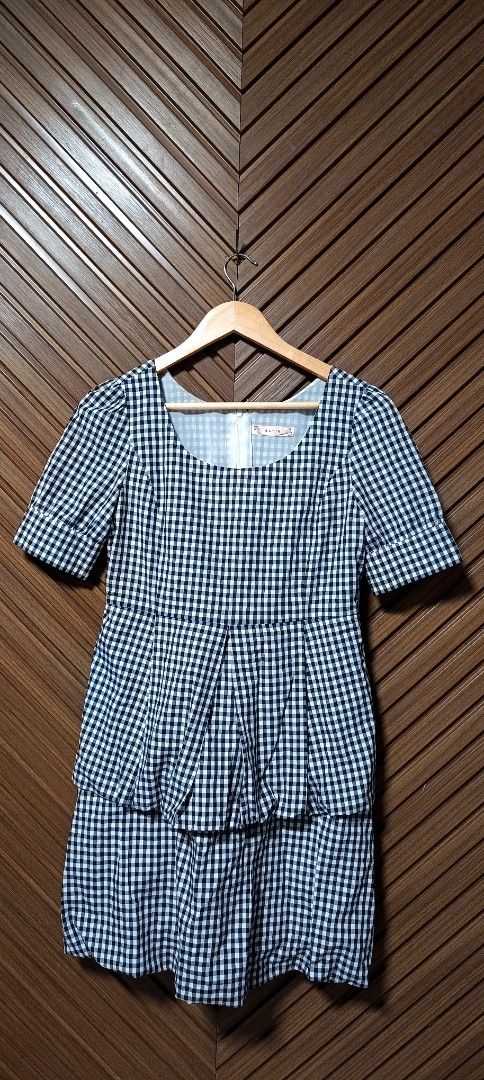 Gingham Tiered Dress with Puff Sleeves (Category: Dresses) located in Davao. Submitted by fabmegashop (Listing ID 1443420596, Image 1). Description: - Adorable black and white gingham pattern - Short puff sleeves for a sweet touch - Flattering tiered skirt design - Bodice features elegant pleating detail - Convenient back zipper closure - Approximate measurements: 17 inches length, 13 inches across the waist - Ideal for casual outings and everyda