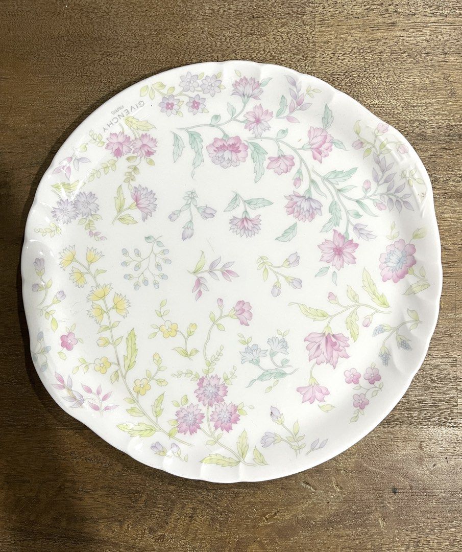 Givenchy Paris Bone China Floral Plate (Category: Dinnerware & Cutlery) located in Pasig City. Submitted by tylernchloe (Listing ID 1443358657, Image 1). Description: - Givenchy Paris Bone China by Yamaka International Japan - Elegant scalloped edge - Approximately 25cm in diameter - Great for serving 9-inch cheesecakes or appetizers, or collection display - See last images for usage wear .