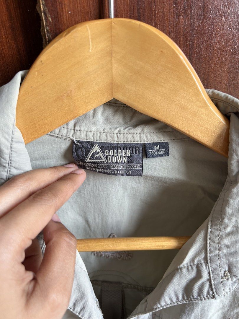Golden Down Hiking Shirt Size M (Category: Shirts) located in Quezon City. Submitted by declutteringpeppers (Listing ID 1443344617, Image 3). Description: - Lightweight short-sleeved hiking shirt by Golden Down - khaki color - Collared neckline with button-up front - Convenient chest pocket - Mesh side panels for enhanced breathability - Back vent for improved airflow - Ideal for all your outdoor adventures.