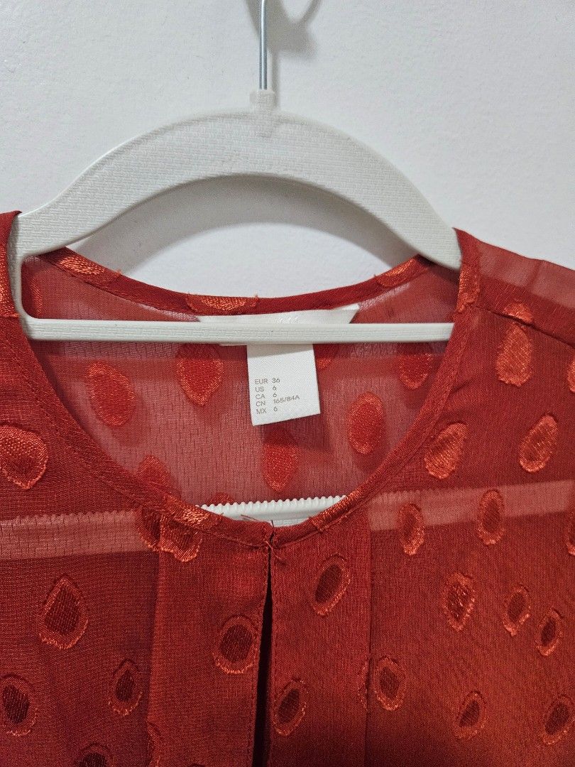 H&M Orange Corporate Office Top Blouse (Category: Blouses) located in Makati City. Submitted by hellok08 (Listing ID 1443399246, Image 3). Description: H&M Top US 6 In excellent used condition Approximate measurements, in inches: Armpit to armpit - 19.5 Waist - 16.5 (adjustable) Length - 27 MOP: BPI/GCash/Unionbank Pick up in Makati via Grab or Lalamove c/o buyer.