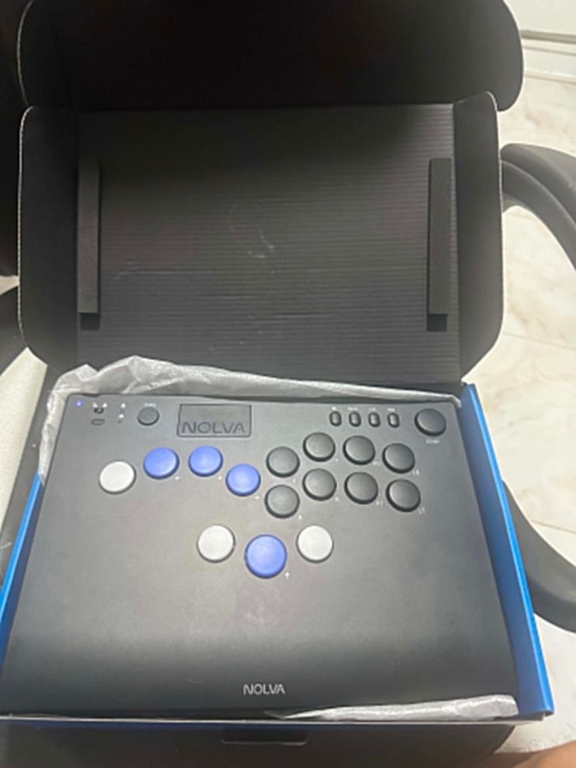 HORI Fighting Stick "NOLVA" Arcade Controller (Category: Controllers) located in Santo Tomas. Submitted by kurigohan1992 (Listing ID 1443415951, Image 1). Description: Selling my HORI Nolva Mechanical All-Button Arcade Controller. The controller is in excellent condition and has no issues or damage. It works properly and was bought on November 25, 2025. I'm too busy to play games now and I haven't used it much, I’m selling it for academic purpose