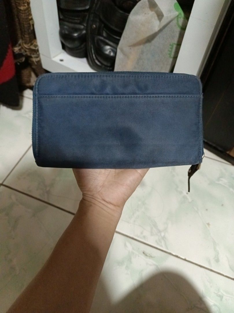 Kate Spade Navy Blue Nylon Zip Around Wallet (Category: Wallets & Card holders) located in Manila. Submitted by caaths_collection (Listing ID 1443424663, Image 2). Description: - Navy blue Kate Spade wallet - Durable nylon material - Secure zip-around closure - Spacious interior for cards and cash - Elegant gold-tone hardware - Ideal for everyday use.