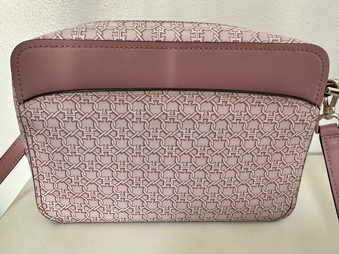 Kate Spade Pink Link Crossbody Bag (Category: Cross-body Bags) located in Mandaluyong City. Submitted by mabv85 (Listing ID 1443373586, Image 3). Description: - Authentic Kate Spade pink crossbody bag - Pink with white chain link print - Zip top closure - Front flap pocket - Interior spade print lining - Adjustable strap - Dimensions in inches: 6”H x 9”W x 2.5”D.