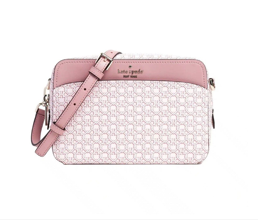 Kate Spade Pink Link Crossbody Bag (Category: Cross-body Bags) located in Mandaluyong City. Submitted by mabv85 (Listing ID 1443373586, Image 2). Description: - Authentic Kate Spade pink crossbody bag - Pink with white chain link print - Zip top closure - Front flap pocket - Interior spade print lining - Adjustable strap - Dimensions in inches: 6”H x 9”W x 2.5”D.
