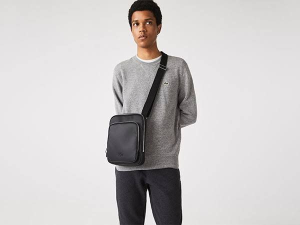 Lacoste Men's Black Crossbody Bag (Category: Cross-body Bags) located in Pasig City. Submitted by cetleo (Listing ID 1443327631, Image 1). Description: - Stylish black crossbody bag - Adjustable strap for comfort - Main compartment with secure zip closure - Interior pockets for easy organization - Convenient front zip pocket - Ideal for daily use - zippers are losing color.