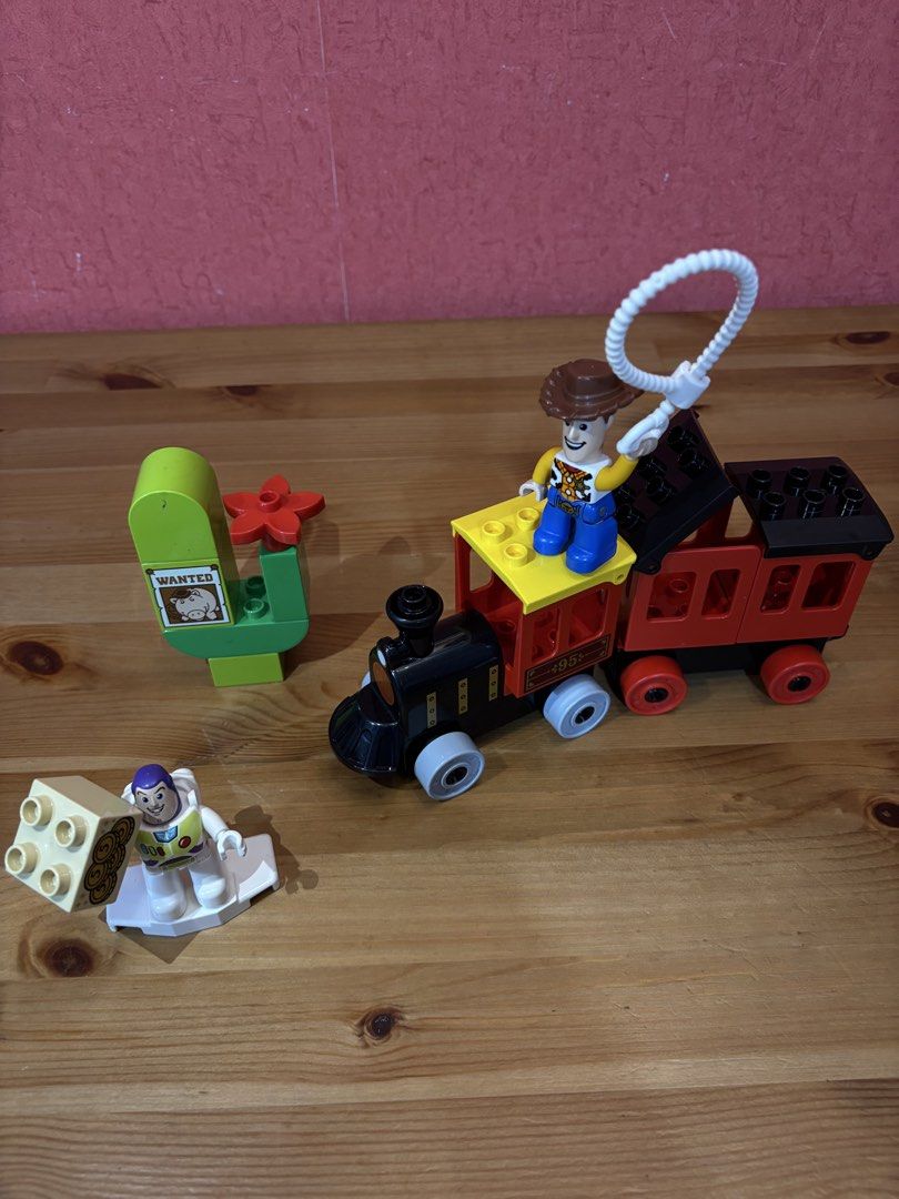 LEGO DUPLO Toy Story Train Set (Category: Lego & Building Sets) located in Paranaque City. Submitted by avec21 (Listing ID 1443406429, Image 2). Description: - LEGO DUPLO Toy Story Train Set - Includes Woody and Buzz Lightyear figures - Comes with a wanted poster and extra bricks - Ideal for young fans of Toy Story - All pieces shown in photos are included - Great for fun playtime.