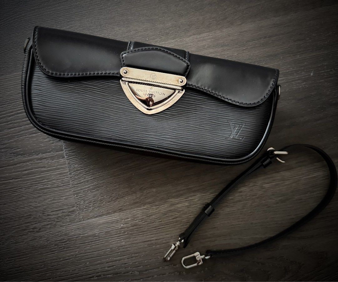 Louis Vuitton Black Clutch Bag with Strap (Category: Luxury Bags & Wallets) located in Pasig City. Submitted by closet_finds1 (Listing ID 1443357401, Image 2). Description: Louis Vuitton clutch in black Epi leather. Features silver hardware and a detachable strap Purchased in Japan No box included Price negotiable.