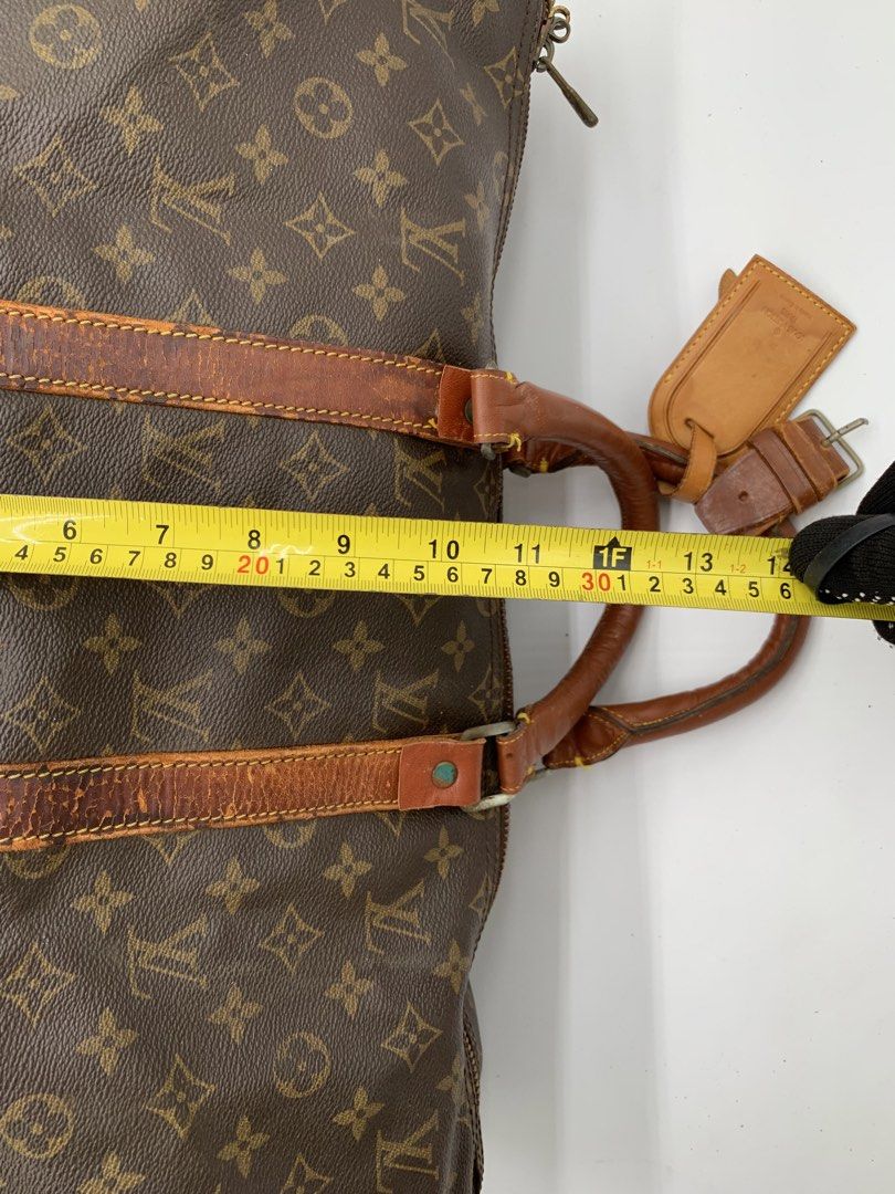 Louis Vuitton Monogram Keepall 55 Duffle Bag (Category: Luxury Bags & Wallets) located in Manila. Submitted by vintageluxgirly24 (Listing ID 1443378710, Image 3). Description: - Classic Louis Vuitton Keepall 55 - Monogram canvas with vachetta leather trim and handles - Ideal for weekend trips or as a carry-on - Zipper closure - Signs of wear on leather and canvas consistent with age and use (please check photos for details) -Authenticity not guar