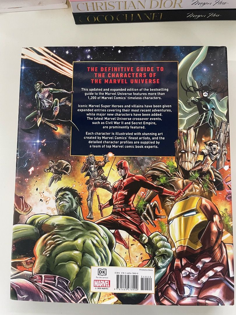 Marvel Encyclopedia New Edition DK Stan Lee Introduction (Category: Comics & Manga) located in Las Pinas. Submitted by strandedonarock (Listing ID 1443364298, Image 2). Description: 💫 Preloved | From personal collection Condition: - Like new - Clean, neat pages - Little to no signs of use - DK Marvel Encyclopedia, New Edition - Definitive guide to the Marvel Universe characters - Features an introduction by Stan Lee - Updated and expanded with n