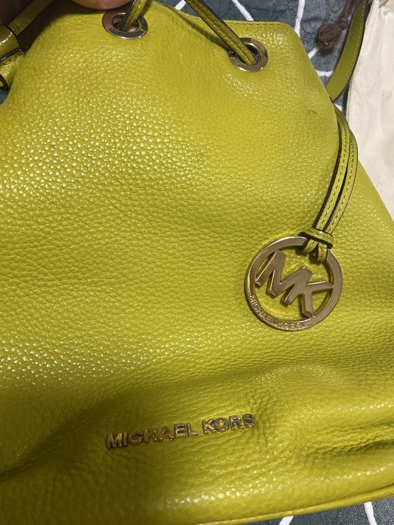 Michael Kors Lime Green Leather Bucket Bag (Category: Luxury Bags & Wallets) located in Mabalacat. Submitted by somethingoldsomethingnew28 (Listing ID 1443427835, Image 2). Description: - Authentic Michael Kors bucket bag - Eye-catching lime green color - Textured leather for a premium feel - Secure drawstring closure - Interior features a zip pocket and slip pockets for organization - Comes with original dust bag and tags - Ideal for everyday us