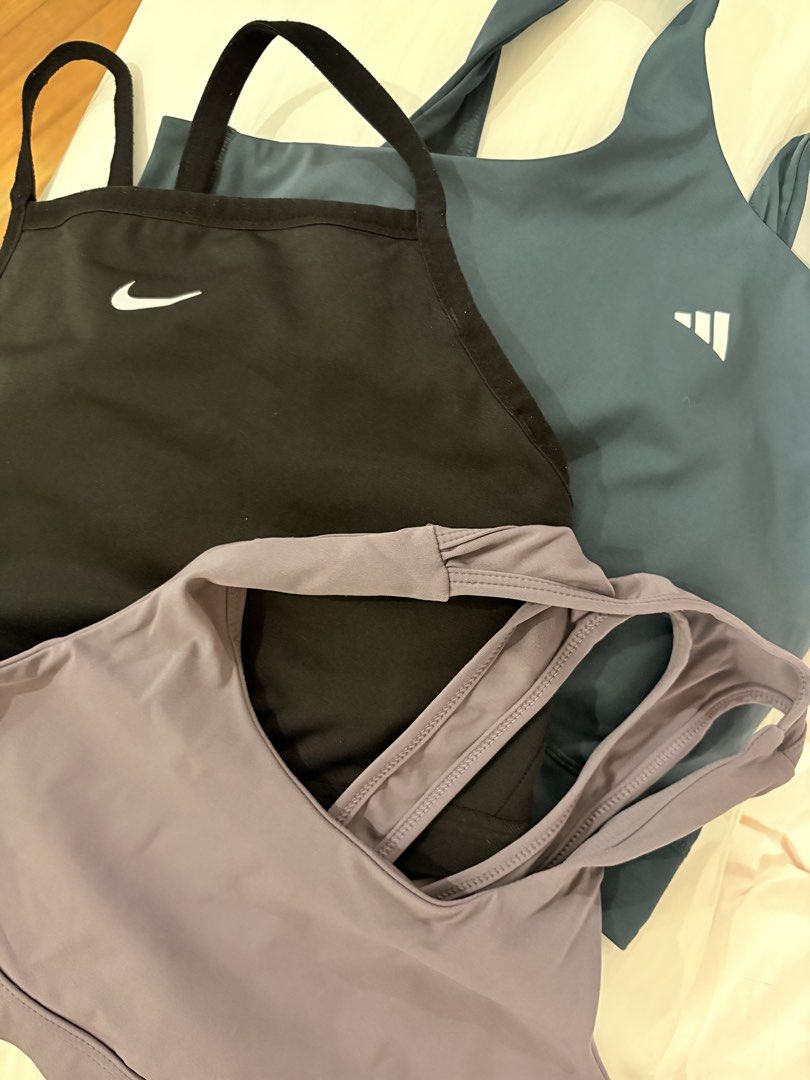 Nike Adidas Sports Bra Bundle (Category: Activewear) located in Davao. Submitted by lovedbylt (Listing ID 1443341957, Image 1). Description: Nike Sports Bra Black Size: XL no flaws no pads Adidas Sports Bra Blue Green Size: L no flaws with pads No Brand Sports Bra Purple fits L-XL no pads.