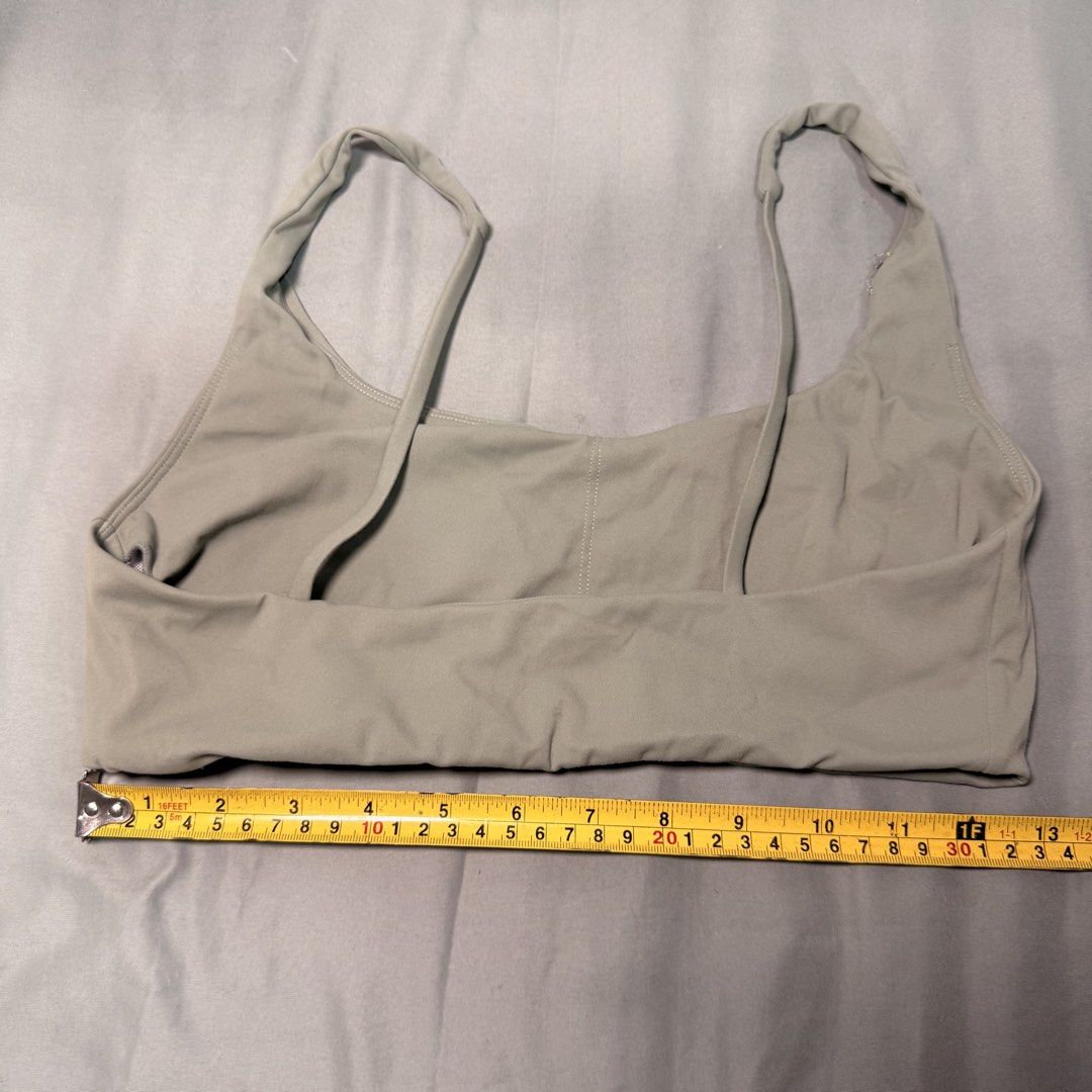 Olive Green Scoop Neck Bikini Top (Category: Bikinis & Swimsuits) located in Cainta. Submitted by avocado121 (Listing ID 1443457855, Image 2). Description: - Chic olive green bikini top - Flattering scoop neck design - Delicate thin straps - Stretchy and comfortable material - Perfect for beach or pool outings - Comfortable fit for all-day wear - Approximately 13 inches across the bust.