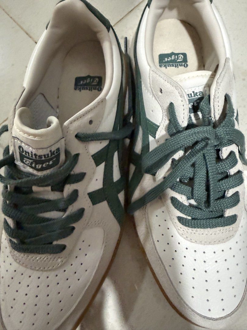 Onitsuka Tiger Mexico 66 Sneakers White Green Gum Sole (Category: Sneakers) located in Singapore. Submitted by mickeytic (Listing ID 1443443407, Image 1). Description: - Classic Onitsuka Tiger sneakers - Color: White with green stripes - Features: Gum sole, perforated toe box - Size: 25cm (UK 5.5 / EU 39.5) - Origin: Made in Indonesia - Ideal for: Casual wear Wear once totally brand new , buy from Japan .