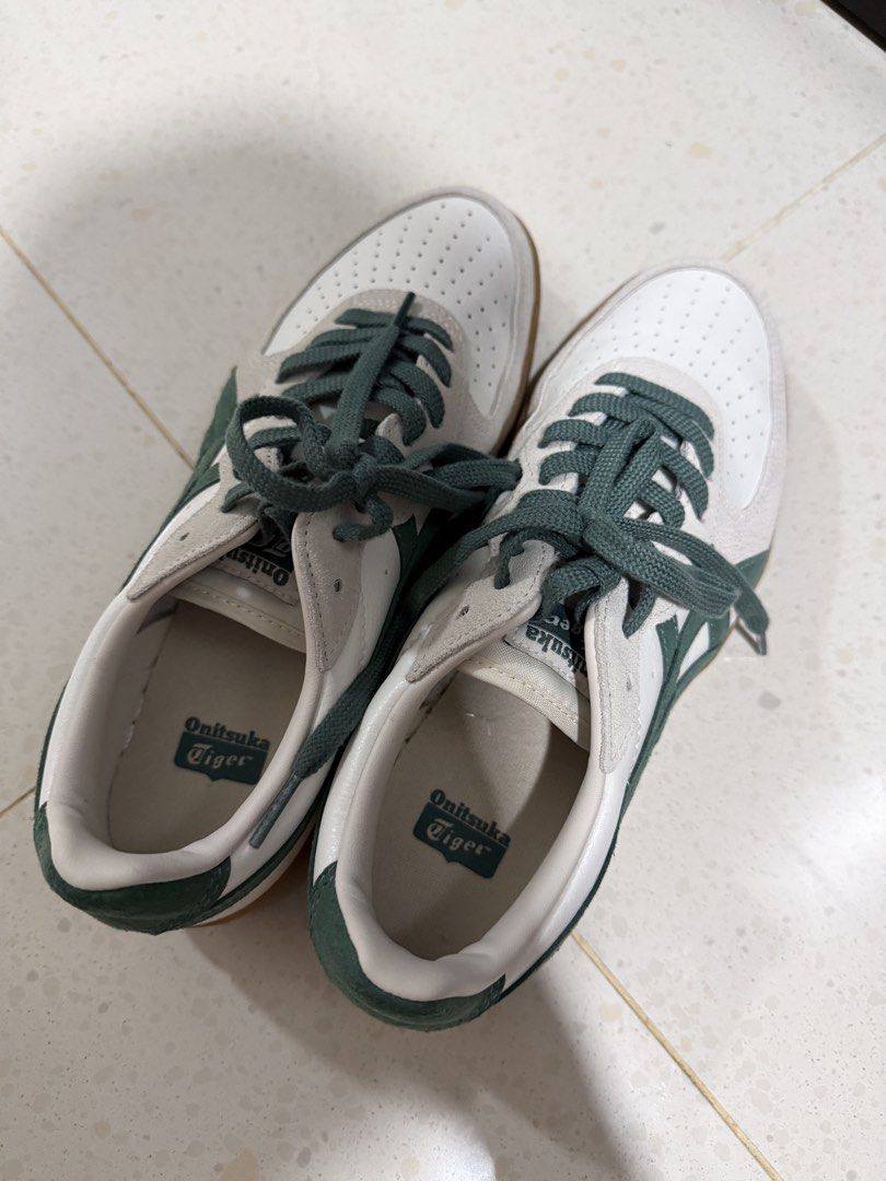 Onitsuka Tiger Mexico 66 Sneakers White Green Gum Sole (Category: Sneakers) located in Singapore. Submitted by mickeytic (Listing ID 1443443407, Image 3). Description: - Classic Onitsuka Tiger sneakers - Color: White with green stripes - Features: Gum sole, perforated toe box - Size: 25cm (UK 5.5 / EU 39.5) - Origin: Made in Indonesia - Ideal for: Casual wear Wear once totally brand new , buy from Japan .