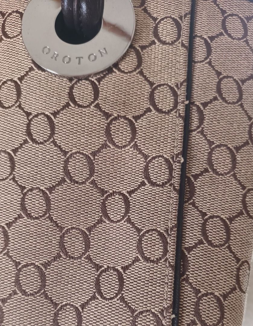 Oroton Monogram Canvas Leather Trim Tote Bag (Category: Luxury Bags & Wallets) located in Pasay City. Submitted by purefox-b7f3 (Listing ID 1443384109, Image 3). Description: - Oroton- Australian brand tote bag with signature monogram pattern - Brown leather trim and handles - Magnetic snap closure - Interior zippered pocket - Classic design, perfect for everyday use - Shows some signs of wear on leather trim and corners but is still very beautif