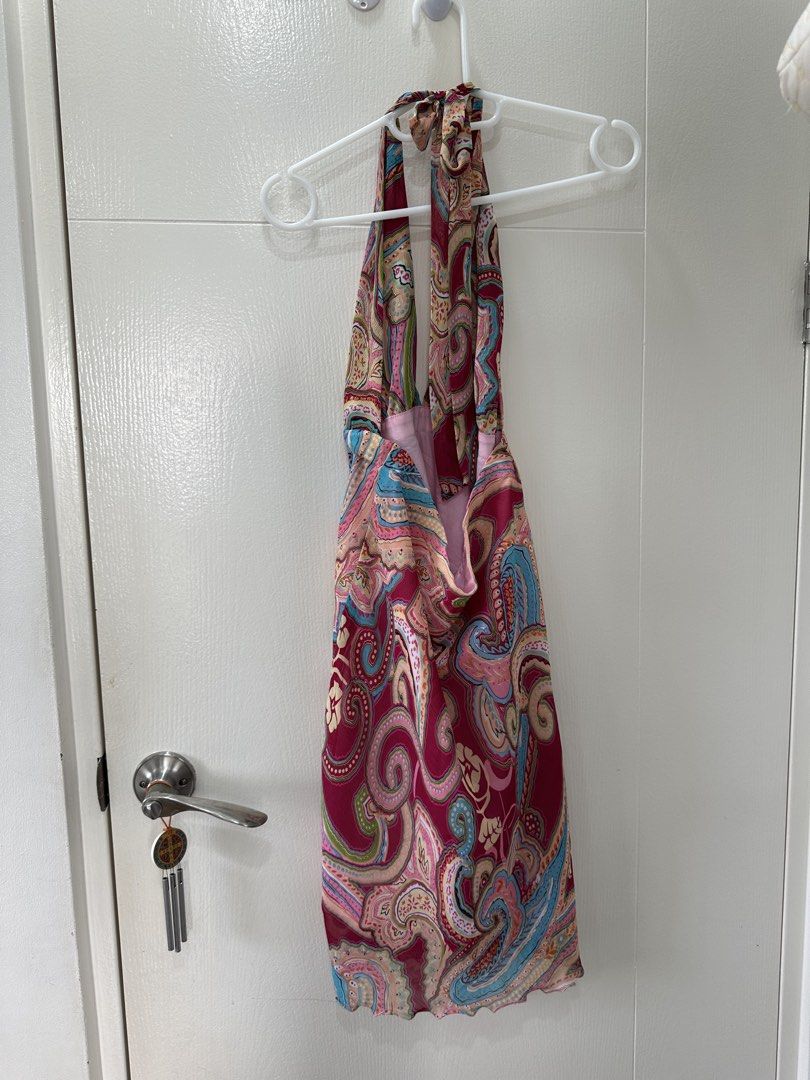 Paisley Halter Neck Mini Dress (Category: Dresses) located in Quezon City. Submitted by _cc_declutters (Listing ID 1443378036, Image 3). Description: - Fun paisley print halter neck dress - Ties at the back of the neck - Lightweight fabric, ideal for warm weather - Features a slight ruffle on the hem - Perfect for beach days or casual outings - Easy to wear and style.