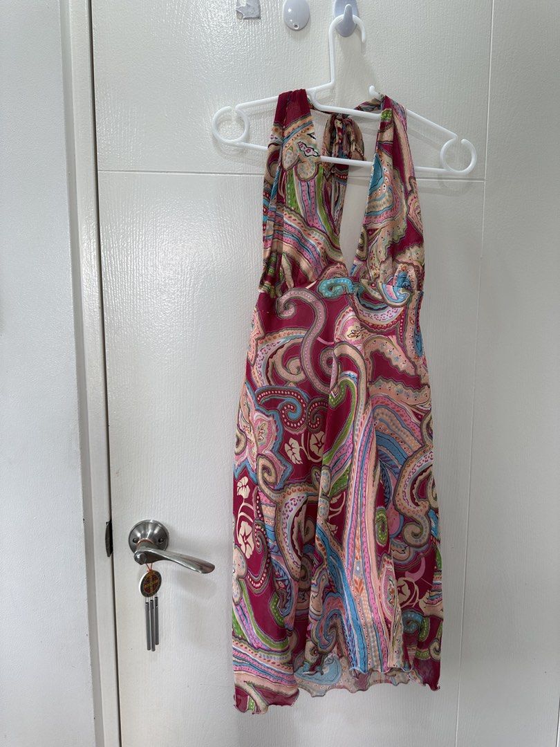Paisley Halter Neck Mini Dress (Category: Dresses) located in Quezon City. Submitted by _cc_declutters (Listing ID 1443378036, Image 2). Description: - Fun paisley print halter neck dress - Ties at the back of the neck - Lightweight fabric, ideal for warm weather - Features a slight ruffle on the hem - Perfect for beach days or casual outings - Easy to wear and style.