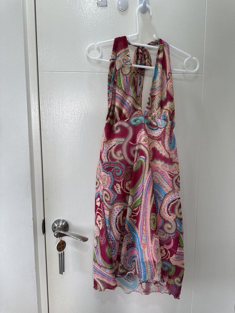 Paisley Halter Neck Mini Dress (Category: Dresses) located in Quezon City. Submitted by _cc_declutters (Listing ID 1443378036, Image 1). Description: - Fun paisley print halter neck dress - Ties at the back of the neck - Lightweight fabric, ideal for warm weather - Features a slight ruffle on the hem - Perfect for beach days or casual outings - Easy to wear and style.