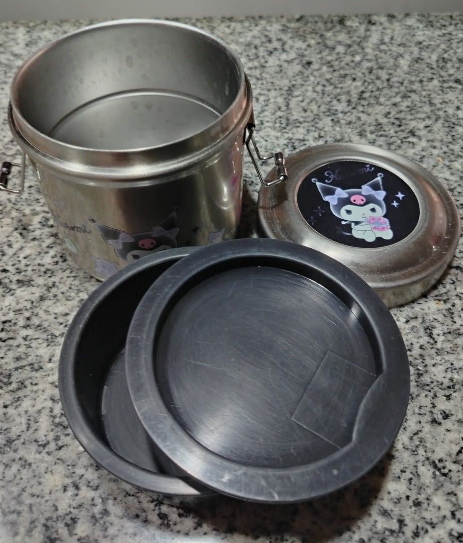 Personal preloved lunch boxes (Category: Food Organization & Storage) located in Quezon City. Submitted by gabbys_closet16 (Listing ID 1443351767, Image 2). Description: - Three lunch boxes perfect for meals on the go! - 1x Stainless Steel Bento Box with cute Kuromi stickers (has minor signs of use). - 1x Pink Two-Tier Bento Box with stainless steel compartments. - 1x Pink Insulated Lunch Container. - Pink lunch boxes are in cleaner condition. - 