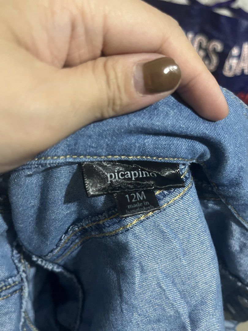Picapino Kids Denim Jacket 12M (Category: Babies & Kids Fashion) located in Antipolo. Submitted by shemgts (Listing ID 1443478797, Image 2). Description: - Adorable blue denim jacket for kids - Classic collar and button-up front - Two functional chest pockets - Ideal for layering over outfits - 12m on tag.