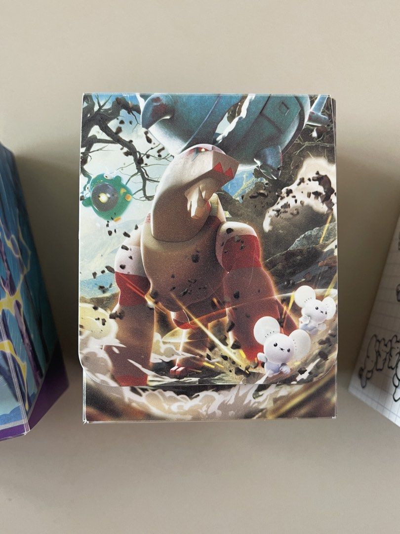 Pokemon Card Game Deck Boxes - Choose 1 for 500 (Category: Card Boxes & Cases) located in Manila. Submitted by shopandscore (Listing ID 1443346659, Image 3). Description: - Official Pokemon Card Game deck boxes - Three unique designs available: - Cool dragon design - Large creature with smaller mice - Cute mouse characters on a grid background - Keep your Pokemon cards organized and protected - Ideal for collectors and players in the Philippines.