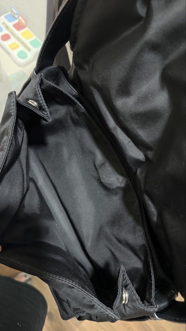 Prada Black Nylon Traveller Bag (Category: Luxury Bags & Wallets) located in Manila. Submitted by authenticprelovedbyjkc (Listing ID 1443347442, Image 3). Description: - SRP 150k+ Authentic Black Prada Shoulder Bag - Durable Nylon Material - Secure Flap Closure with Snap Button - Interior Zippered Compartment - Interior Slip Pocket - Genuine Leather Strap - Ideal for Everyday Use.