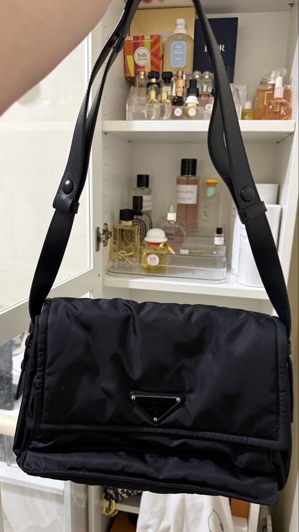 Prada Black Nylon Traveller Bag (Category: Luxury Bags & Wallets) located in Manila. Submitted by authenticprelovedbyjkc (Listing ID 1443347442, Image 2). Description: - SRP 150k+ Authentic Black Prada Shoulder Bag - Durable Nylon Material - Secure Flap Closure with Snap Button - Interior Zippered Compartment - Interior Slip Pocket - Genuine Leather Strap - Ideal for Everyday Use.