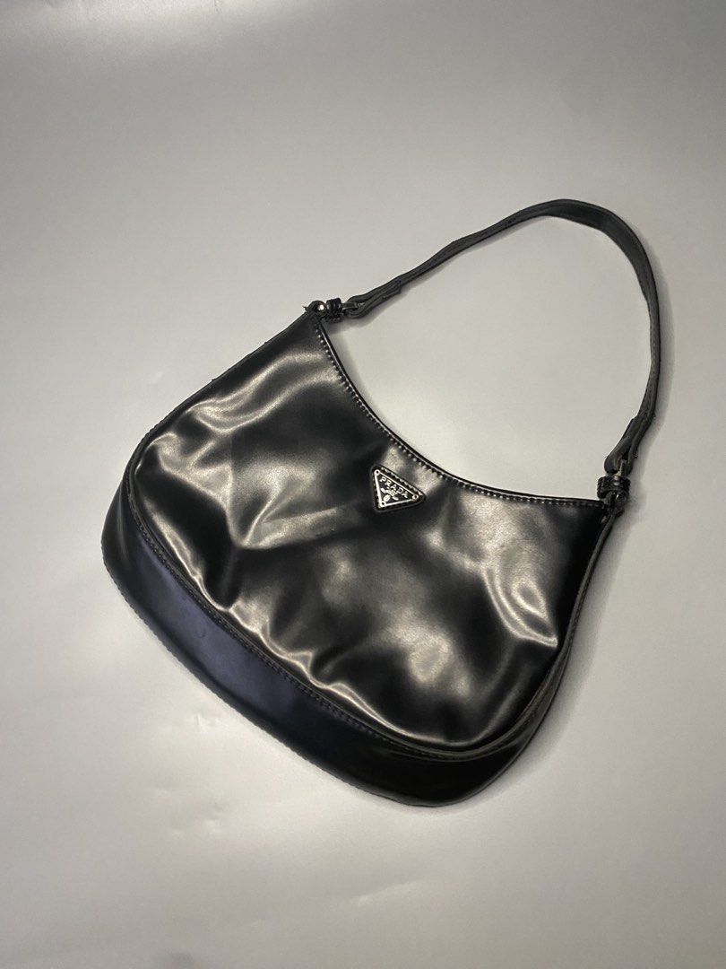 Prada Black Shoulder Bag (Category: Luxury Bags & Wallets) located in Cebu City. Submitted by nardcen (Listing ID 1443344323, Image 3). Description: - Classic black Prada shoulder bag - Simple and chic design - Adjustable strap with buckles - Perfect for everyday use - Shows some signs of wear, but in good overall condition - A timeless addition to your collection.