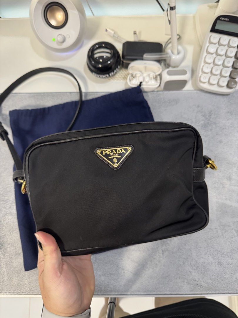 Prada Nylon Crossbody Bag with Entrupy (Category: Luxury Bags & Wallets) located in Morong. Submitted by deegee1234 (Listing ID 1443340624, Image 2). Description: - Authentic Prada nylon crossbody bag - Features gold-tone hardware - Iconic Prada triangle logo - Leather trim and strap - Comes with original dust bag - Ideal for everyday use or travel - Spacious interior for essentials - 40-50k in online sellers With Entrupy RFS decluttering .