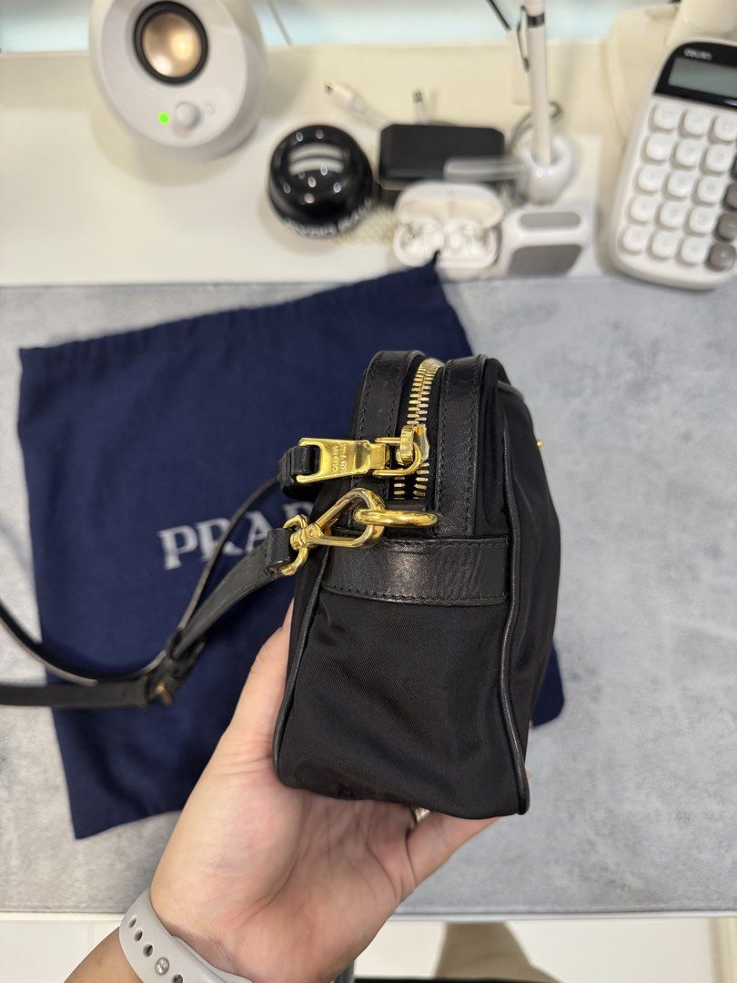 Prada Nylon Crossbody Bag with Entrupy (Category: Luxury Bags & Wallets) located in Morong. Submitted by deegee1234 (Listing ID 1443340624, Image 3). Description: - Authentic Prada nylon crossbody bag - Features gold-tone hardware - Iconic Prada triangle logo - Leather trim and strap - Comes with original dust bag - Ideal for everyday use or travel - Spacious interior for essentials - 40-50k in online sellers With Entrupy RFS decluttering .