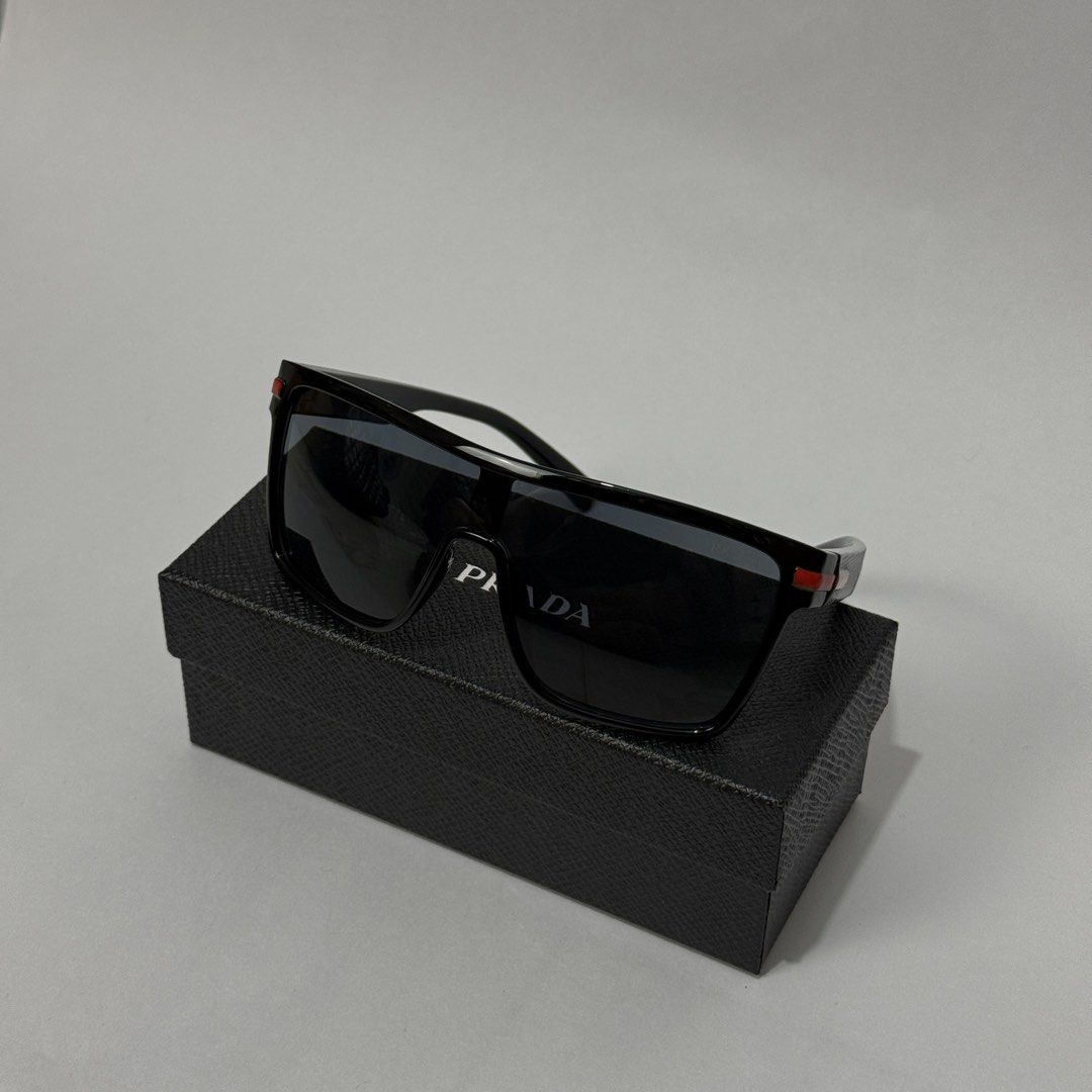 PRADA SUNGLASSES (Category: Luxury Accessories) located in Dagupan City. Submitted by armoirelux (Listing ID 1443447676, Image 2). Description: Comes with box.