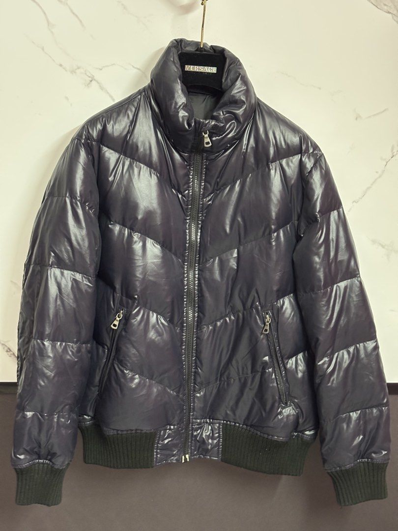 Premium Down Jacket Medium (Category: Coats, Jackets and Outerwear) located in Puchong. Submitted by putrydelrey (Listing ID 1443383182, Image 1). Description: - Dark navy puffer jacket - Stylish chevron quilting - Comfortable ribbed cuffs and hem - Convenient zipper closure with pockets - Premium down filling for warmth and lightness - Ideal for cold weather adventures.
