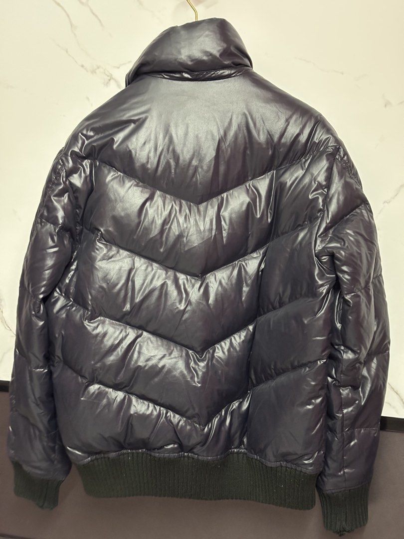 Premium Down Jacket Medium (Category: Coats, Jackets and Outerwear) located in Puchong. Submitted by putrydelrey (Listing ID 1443383182, Image 2). Description: - Dark navy puffer jacket - Stylish chevron quilting - Comfortable ribbed cuffs and hem - Convenient zipper closure with pockets - Premium down filling for warmth and lightness - Ideal for cold weather adventures.
