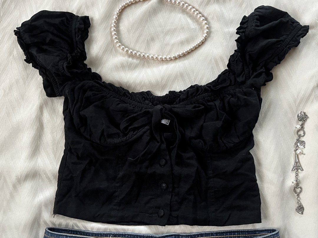 Princess Polly Black Milkmaid Puff Sleeves Top (Category: Others Tops) located in Manila. Submitted by avenelle.co (Listing ID 1443476636, Image 2). Description: - Black Puff sleeves top - Tie front detail - Ruched sleeves - TOP ONLY - Missing button but was stitched (not visible at all) - Feel free to ask about the condition - For Decluttering Purposes - Gcash Payment - Will be shipped through J&T .
