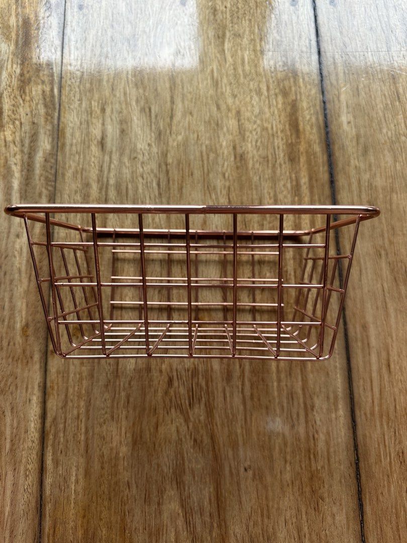 Rose Gold Wire Storage Basket Organizer (Category: Storage Boxes & Baskets) located in Manila. Submitted by ellie.copter (Listing ID 1443399593, Image 2). Description: - Cute rose gold wire basket - Perfect for organizing small items on your desk or vanity - Ideal for stationery, makeup, or small accessories - Features a simple grid design LxWxH: 8in x 6in x 3in.