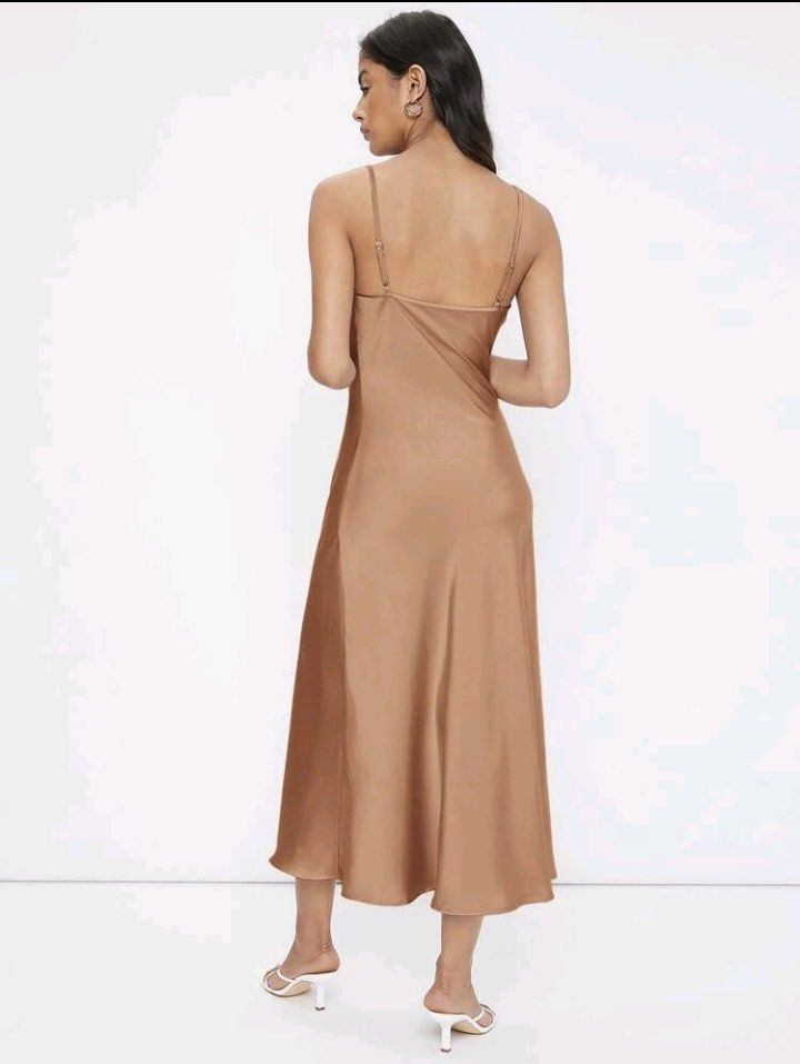 Satin Cowl Neck Slip Dress (Category: Dresses) located in Manila. Submitted by dkcoshop (Listing ID 1443322672, Image 2). Description: - Beautiful satin slip dress - Midi length - Adjustable spaghetti straps - Flattering cowl neckline - Soft fabric with a nice drape - Perfect for dressing up or down, events, or a night out - Color: Apricot Never worn. Brand new. Last Price ‼️.