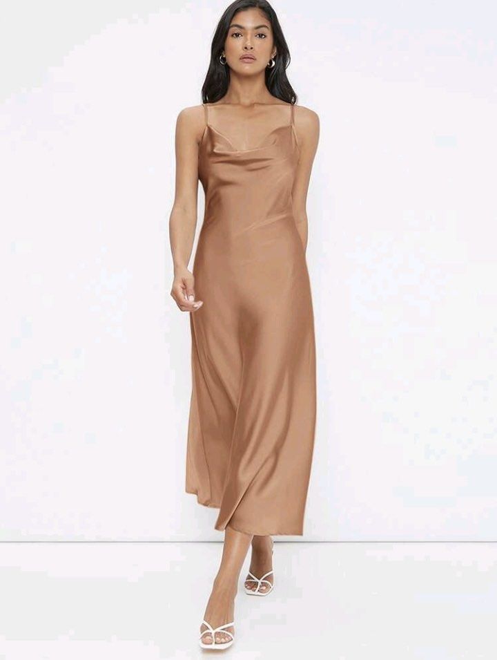 Satin Cowl Neck Slip Dress (Category: Dresses) located in Manila. Submitted by dkcoshop (Listing ID 1443322672, Image 1). Description: - Beautiful satin slip dress - Midi length - Adjustable spaghetti straps - Flattering cowl neckline - Soft fabric with a nice drape - Perfect for dressing up or down, events, or a night out - Color: Apricot Never worn. Brand new. Last Price ‼️.