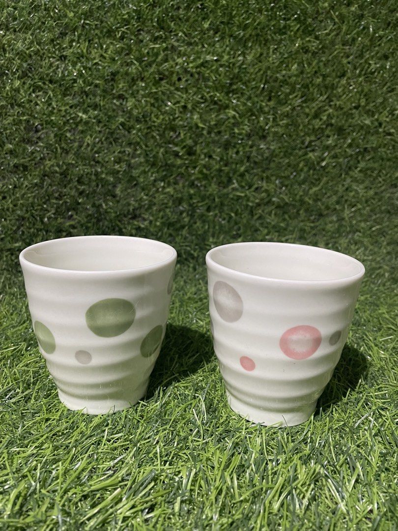 Set of 2 Ceramic Cups with Polka Dot Design (Category: Coffee & Tea Tableware) located in Quezon City. Submitted by lanqcqc (Listing ID 1443437748, Image 1). Description: Set of 2 white ceramic cups with fun polka dots (green/grey and pink/grey). Ribbed texture. Approx. 3" D x 3" H. Great for coffee or tea. japan surplus / pre-loved; as is unless declared new manage your expectations/ please NO TO maselan or choosy 1 to 2 days reservation only❗️ 