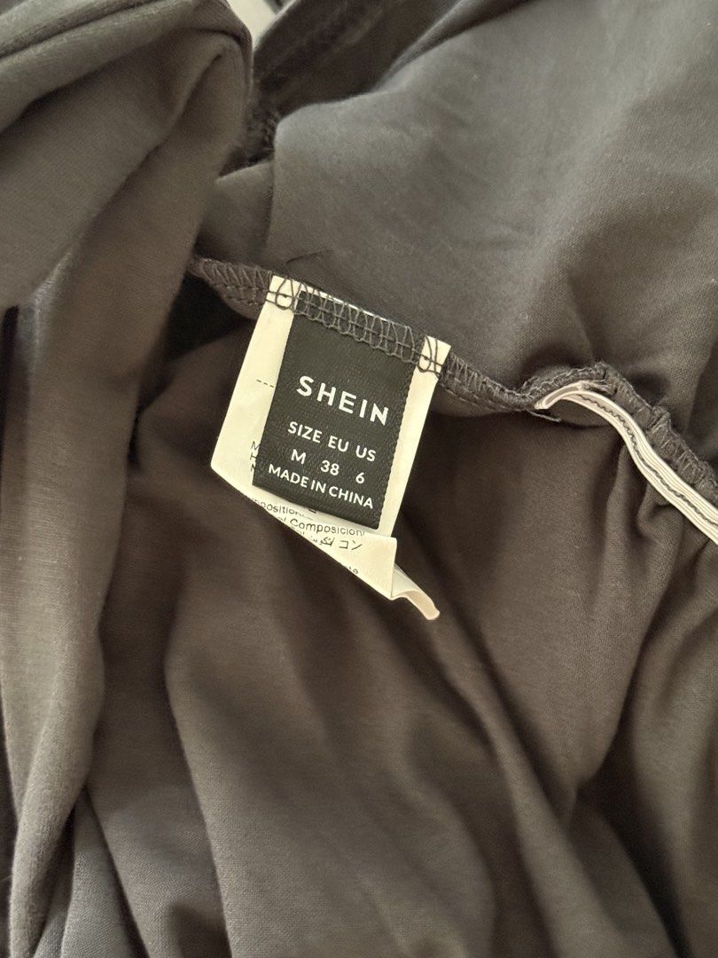 SHEIN Dark Grey Long Sleeve Top (Category: Longsleeves) located in Mandaluyong City. Submitted by annestuffing (Listing ID 1443352597, Image 3). Description: - Basic dark grey long sleeve top - Padded shoulders - Crew neck and fitted style - Comfortable and stretchy material - Versatile for layering or wearing on its own - Available in Medium and XL sizes.