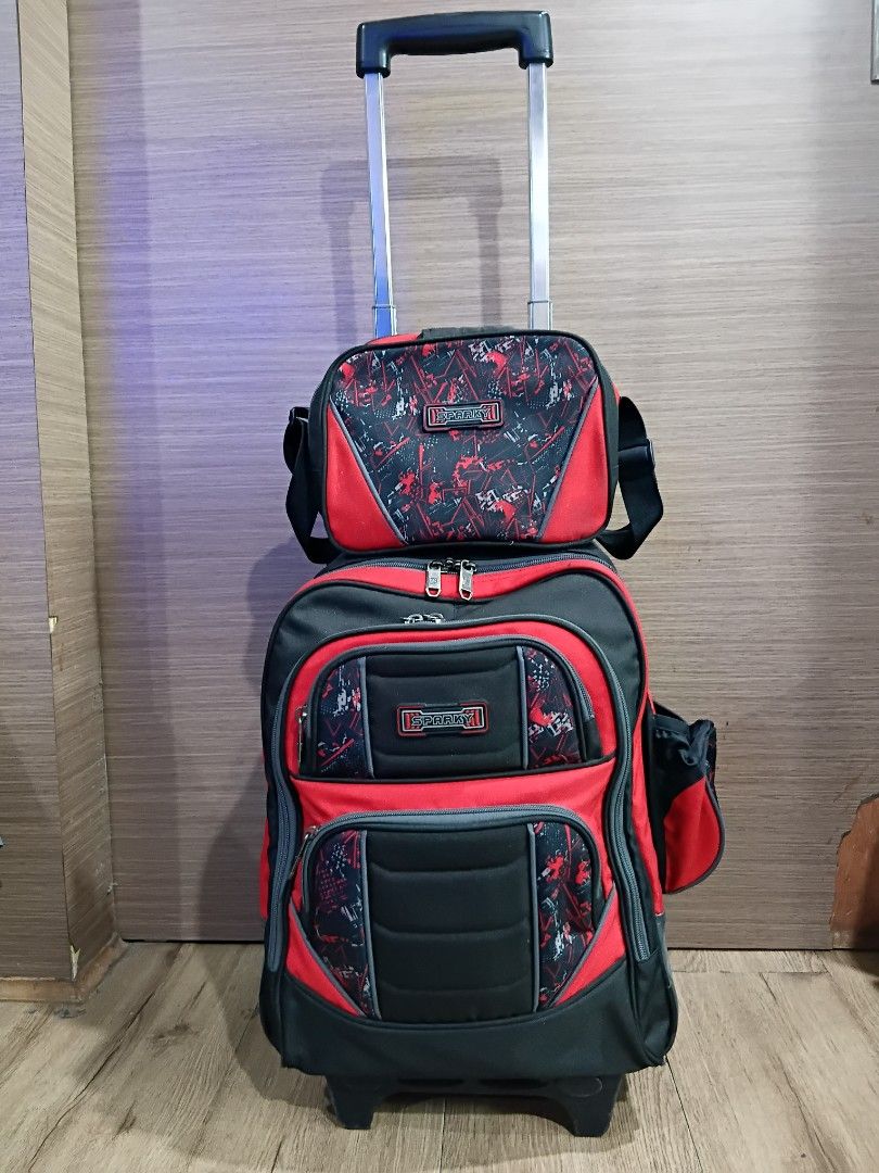 Sparky Trolley School Bag with Lunch Bag (Category: Babies & Kids Fashion) located in Manila. Submitted by ramcyanthony (Listing ID 1443445010, Image 1). Description: - Php1300 (bought for 3k plus) - Sturdy and stable base (stays upright doesnt fall over) - Trolley bag has no damage - Insulated lunch bag natastas inner lining (repairable) - Spacious main compartment with large opening - Durable, sturdy zippers - Smooth-rolling wheels and extendab