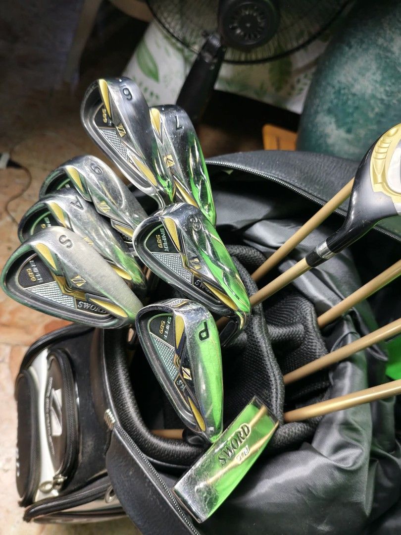 SWORD Golf Club Set with Bag (Category: Golf) located in Manila. Submitted by yeonmei5614747 (Listing ID 1443441349, Image 3). Description: Premium Complete Katana Golf Sword Sniper golf club set. Includes various irons (P, S, A,6- 9i ) and woods (U4, U5, Driver Putter fw ). The clubs are in a black golf bag. The clubs have gold and silver accents. Right Handed Club R flex.. sword speeder 589 graphite shaft.