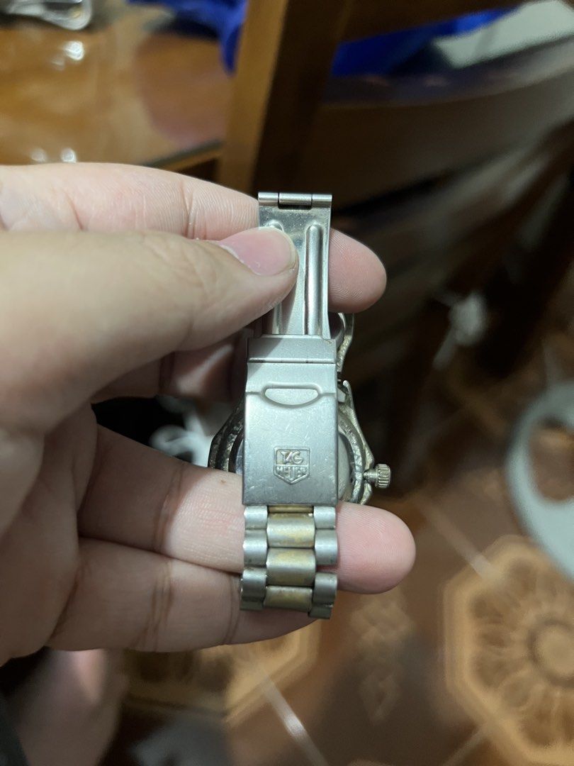TAG Heuer Watch with Compass - Two-Tone (Category: Luxury Watches) located in Manila. Submitted by mark_decluttering (Listing ID 1443416583, Image 2). Description: - TAG Heuer watch - Two-tone metal bracelet - Rotating bezel with built-in compass - Date window at 3 o'clock - Clasp features the iconic TAG Heuer logo - Ideal for watch collectors or everyday wear - Not working.