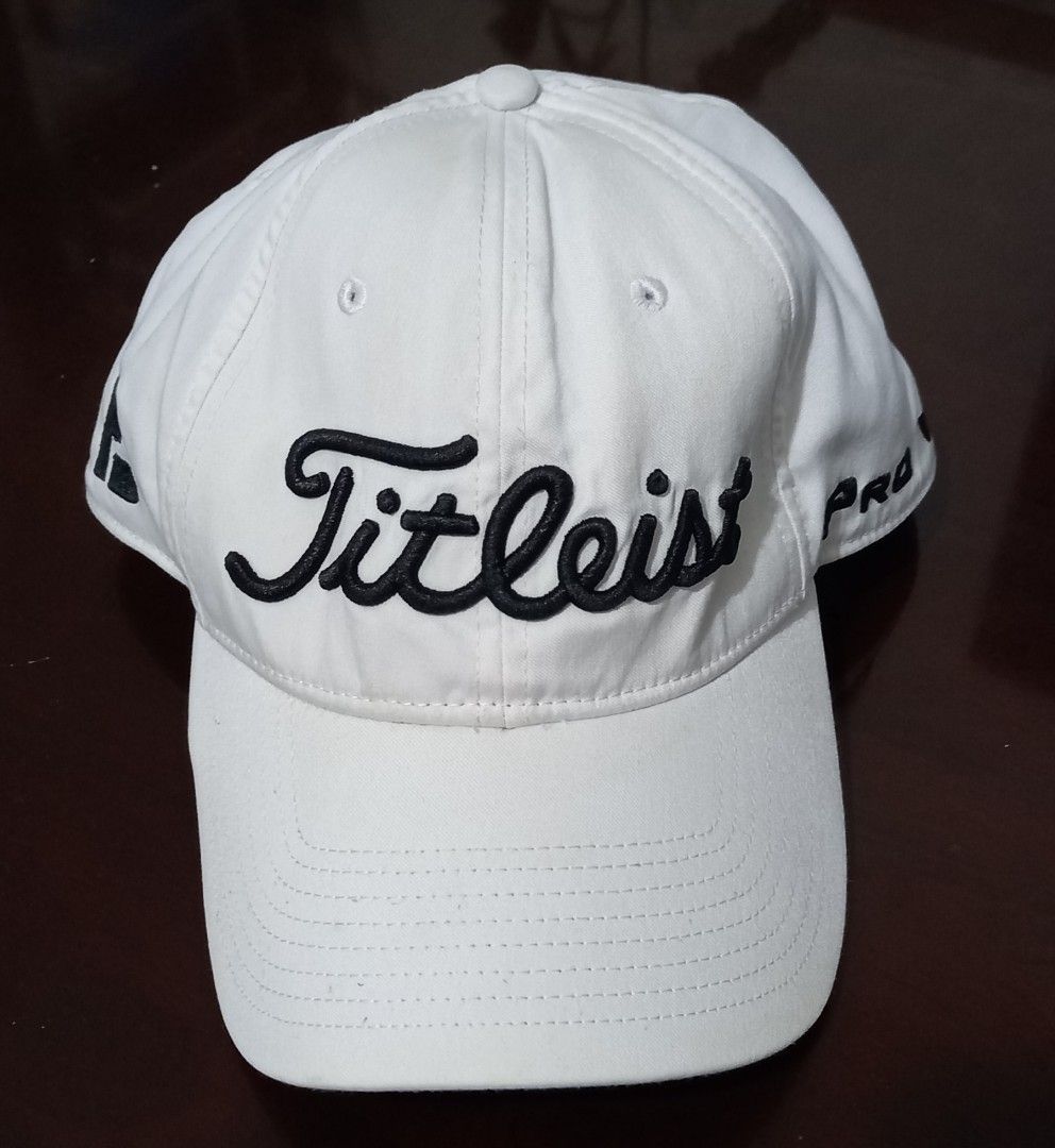 Titleist Pro V1 Golf Cap White (Category: Caps & Hats) located in Cagayan de Oro. Submitted by edwardryan01984 (Listing ID 1443447688, Image 2). Description: - Classic white Titleist Pro V1 cap - Features embroidered Titleist script logo on front - FJ logo detail on the side - Adjustable strap for a custom, comfortable fit - Ideal for sunny days and golf rounds.