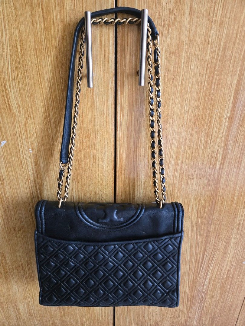 Tory Burch Fleming Medium Convertible Shoulder Bag (Category: Luxury Bags & Wallets) located in Cabuyao City. Submitted by brandedhanger (Listing ID 1443406946, Image 2). Description: Condition: - good condition - with minor signs of use and little cracks - Original - some pressmarks on the leather flap due to storage Details: Color: Black Hardware: Gold tone Material: Leather Approximate Dimensions in inches: H9 × W10 × D2.5 Color may vary due t
