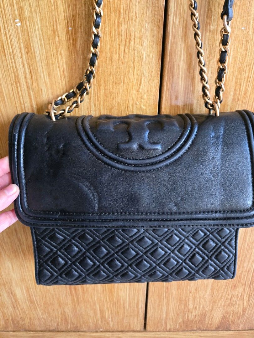Tory Burch Fleming Medium Convertible Shoulder Bag (Category: Luxury Bags & Wallets) located in Cabuyao City. Submitted by brandedhanger (Listing ID 1443406946, Image 3). Description: Condition: - good condition - with minor signs of use and little cracks - Original - some pressmarks on the leather flap due to storage Details: Color: Black Hardware: Gold tone Material: Leather Approximate Dimensions in inches: H9 × W10 × D2.5 Color may vary due t