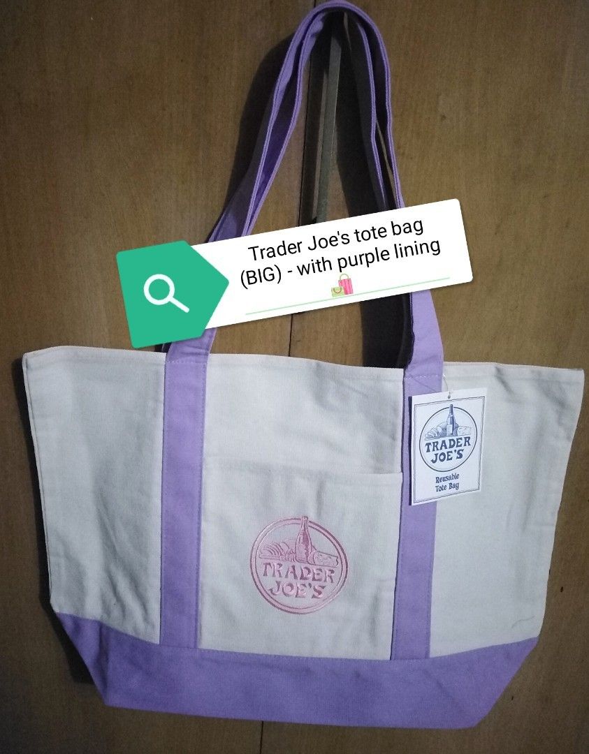 Trader Joe's Canvas Tote Bag (BIG) (Category: Tote Bags) located in Taguig. Submitted by juls0607 (Listing ID 1443426156, Image 2). Description: - Trader Joe's Big size Tote Bag - Features sturdy handles - White canvas body with dark blue/navy blue accents on bottom and handles - Features embroidered Trader Joe's logo on the side by side pocket made of canvas material - Ideal for grocery shopping or everyday errands - Durable and reusable - 100% 