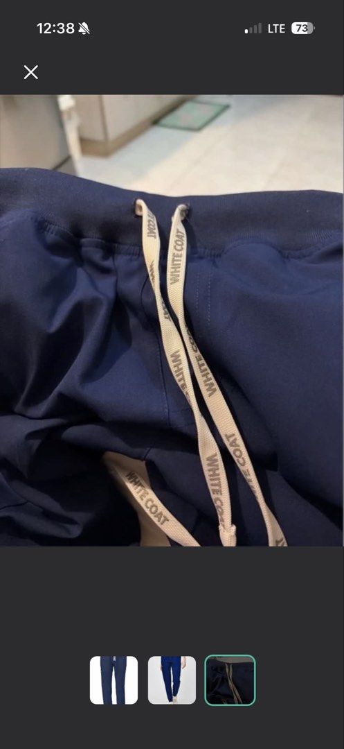 White Coat Navy Blue Jogger Scrub Pants (Category: Other Bottoms) located in Quezon City. Submitted by trishaysa16 (Listing ID 1443354486, Image 3). Description: - Brand: White Coat - Color: Navy Blue - Style: Jogger Scrub Pants - Features: Elastic waistband with drawstring, multiple zippered side pockets, cuffed ankles - Benefits: Comfortable and functional for work.